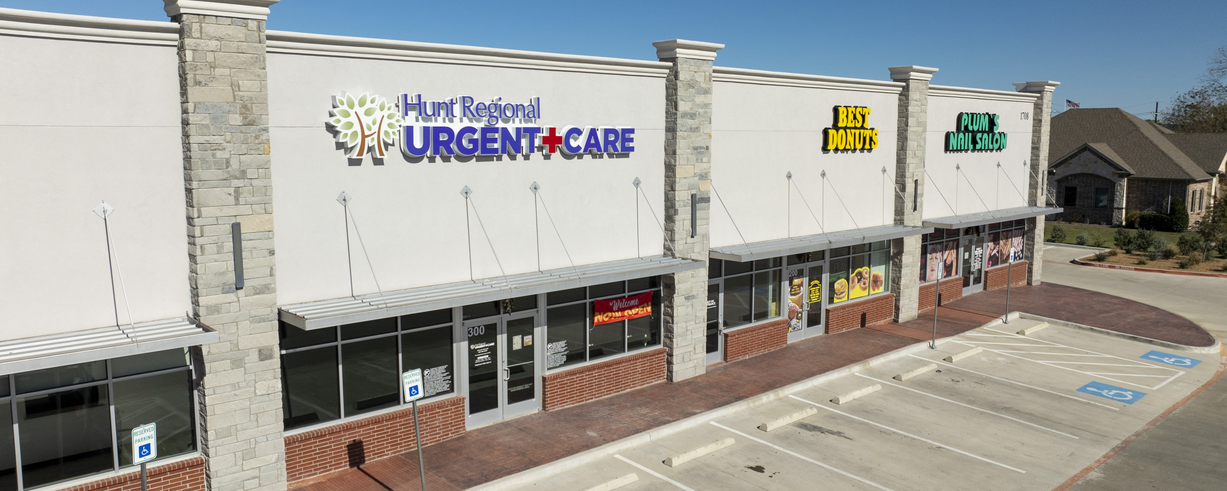 Hunt Regional, Best Donutes, and Plum's Nail Salon Store fronts