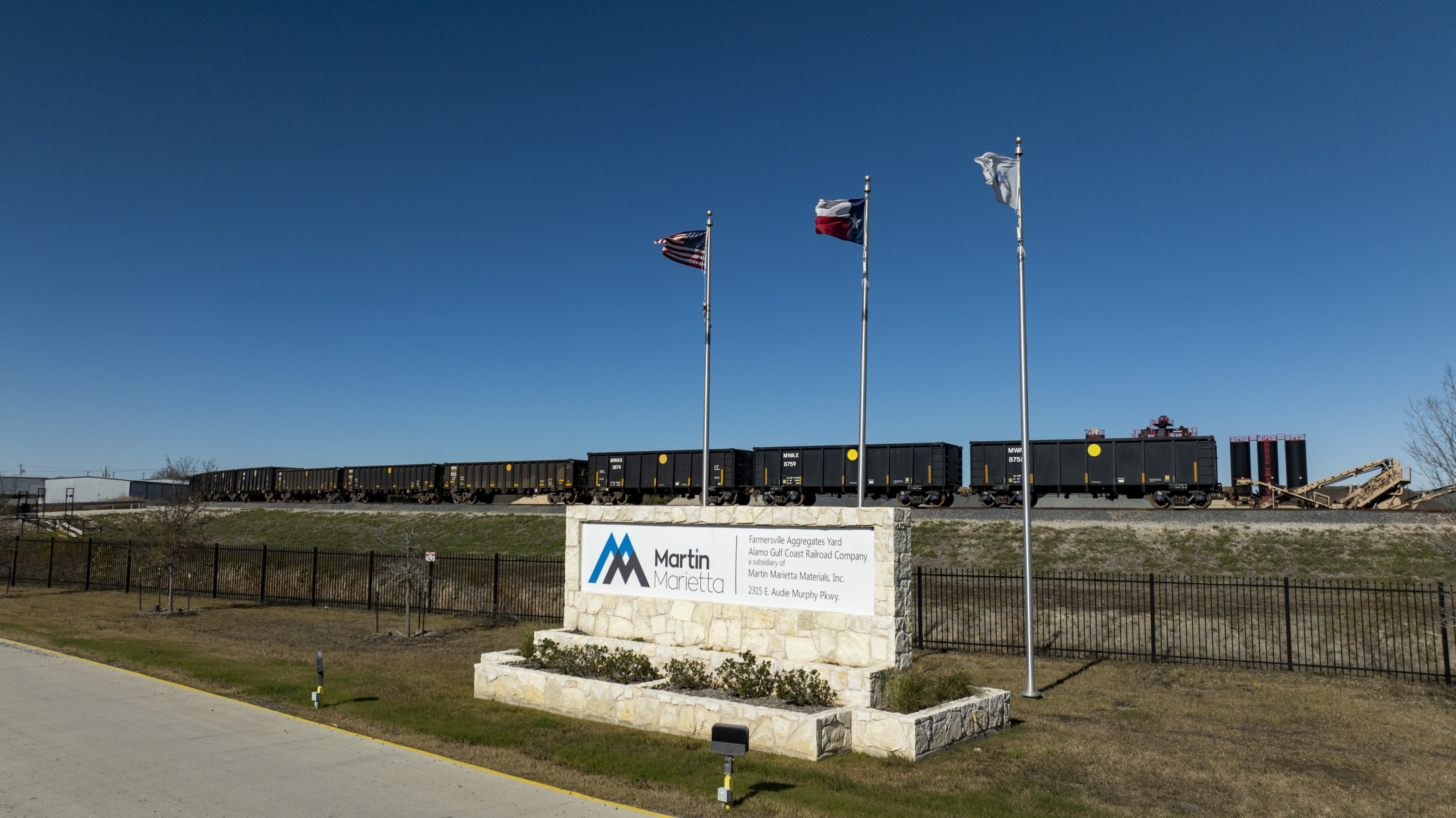 Martin Marietta Sign with Rail cars in the background on tracks