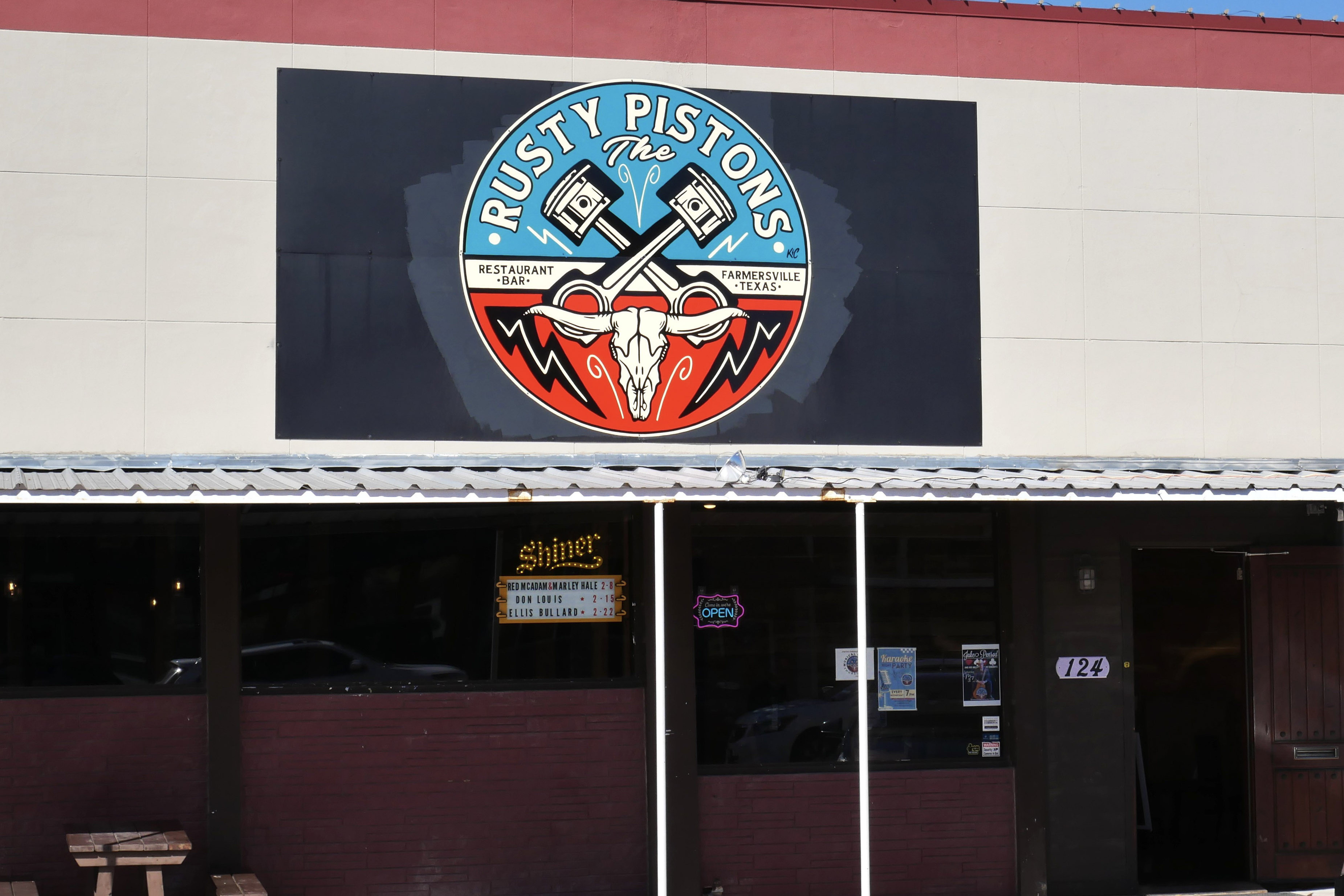 The Rusty Pistons storefront and sign