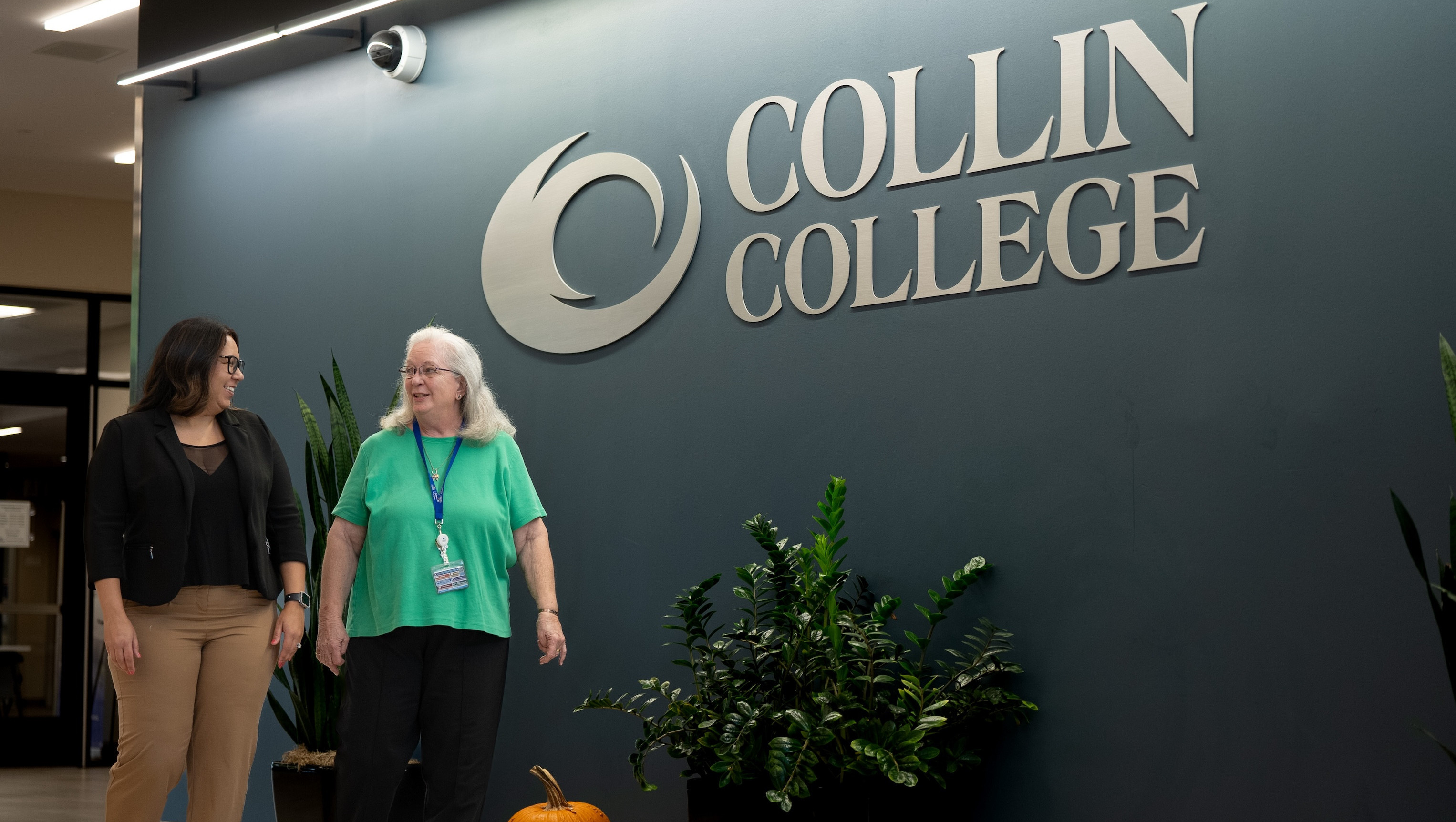 Collin College staff walking through a hall